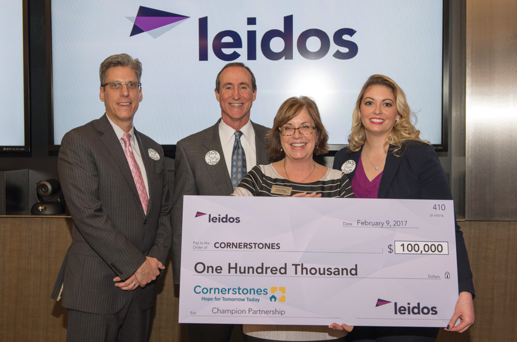 Leidos presented Cornerstones with a check of $100,000 - Mike Coogan, Leidos; Mark Ingrao, GRCC; Kerrie Wilson, Cornerstones; Melissa Koskovich, Leidos.