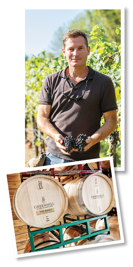winemaker and wine barrels